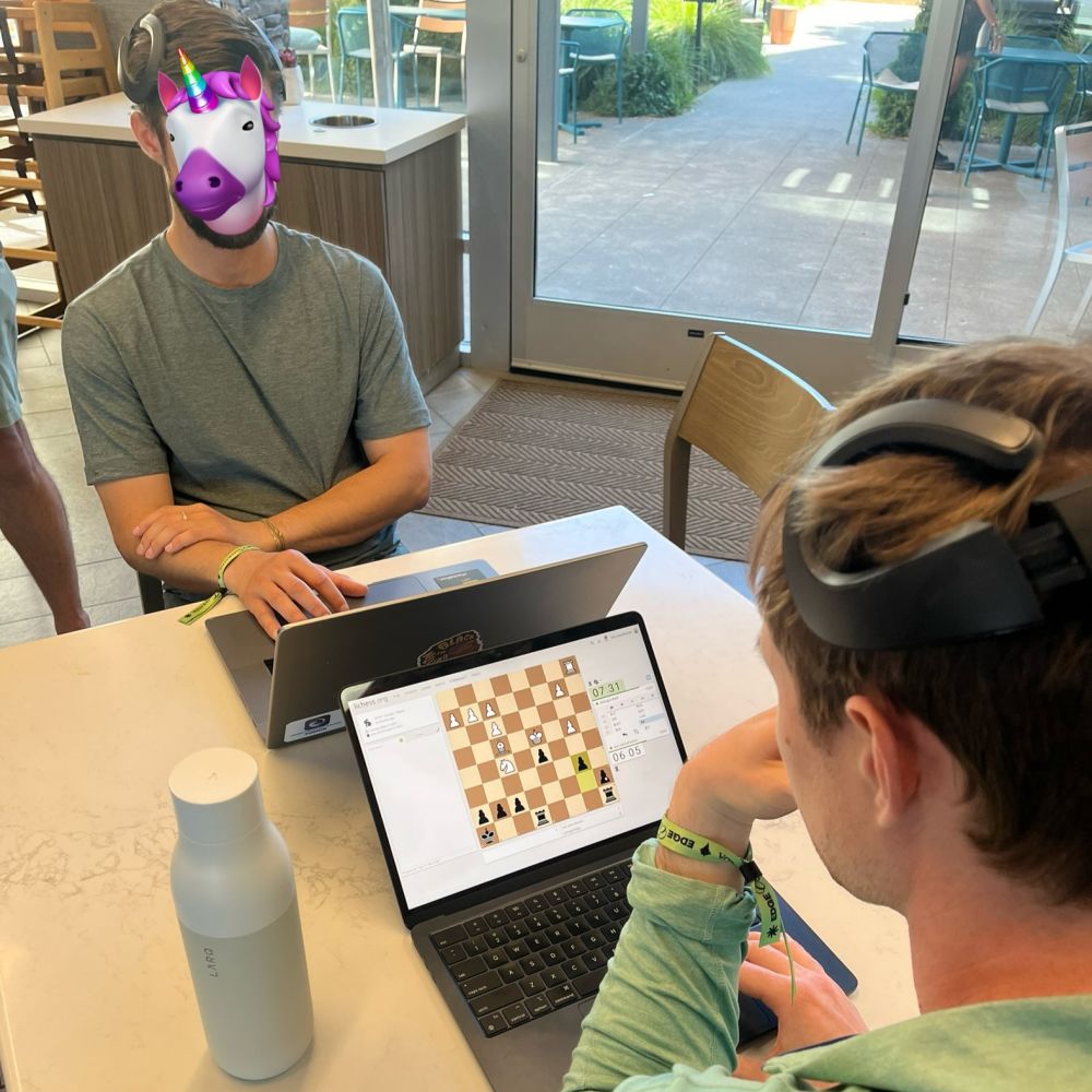 People playing chess and having their brain activity recorded